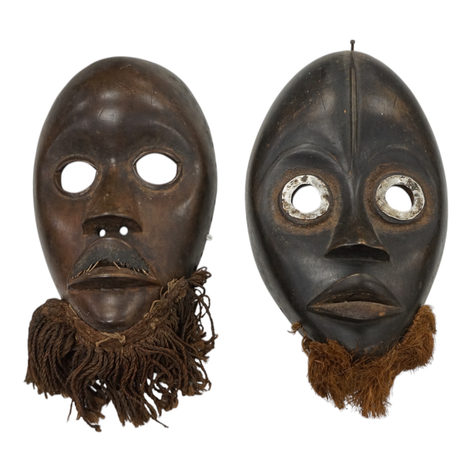 Two African Ivory Coast/Liberian Dan masks, 23cm high. Condition - fair